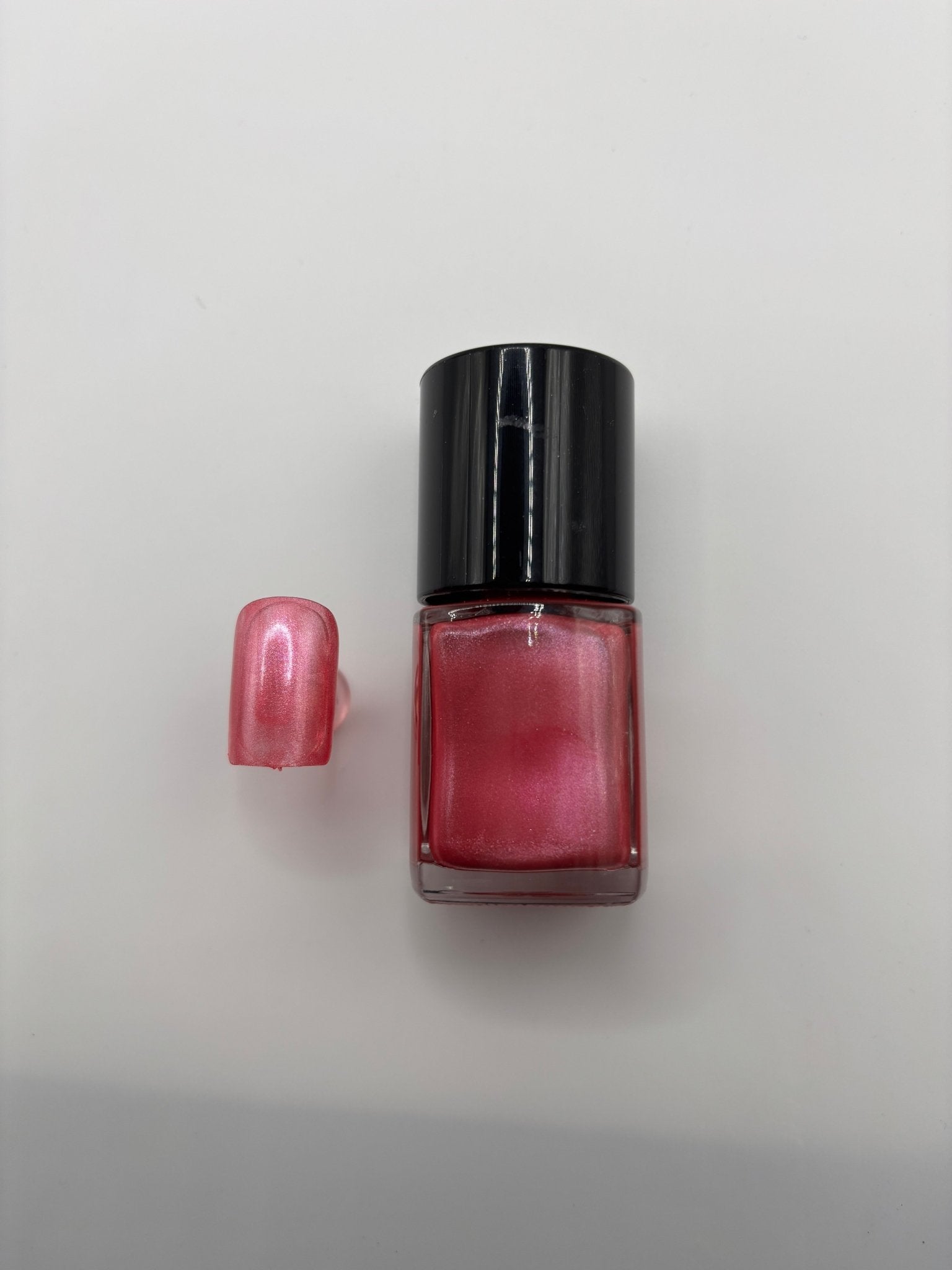 BOTTLE OF MACKARA WITH FAKE NAIL SAME POLISH