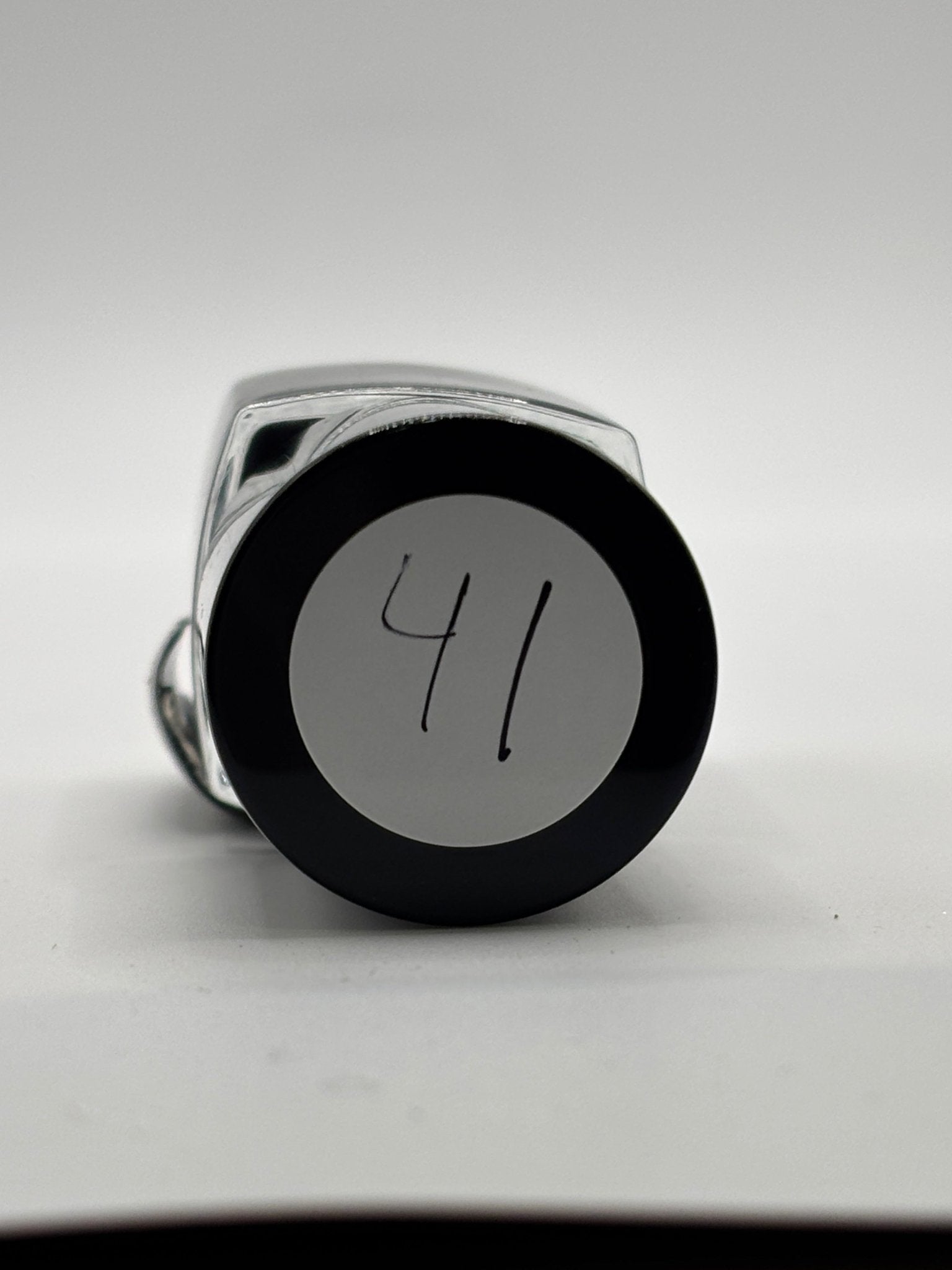 BOTTLE OF NALISA SHOWING THE TOP OF THE BOTTLE WITH THE # 41 ON IT