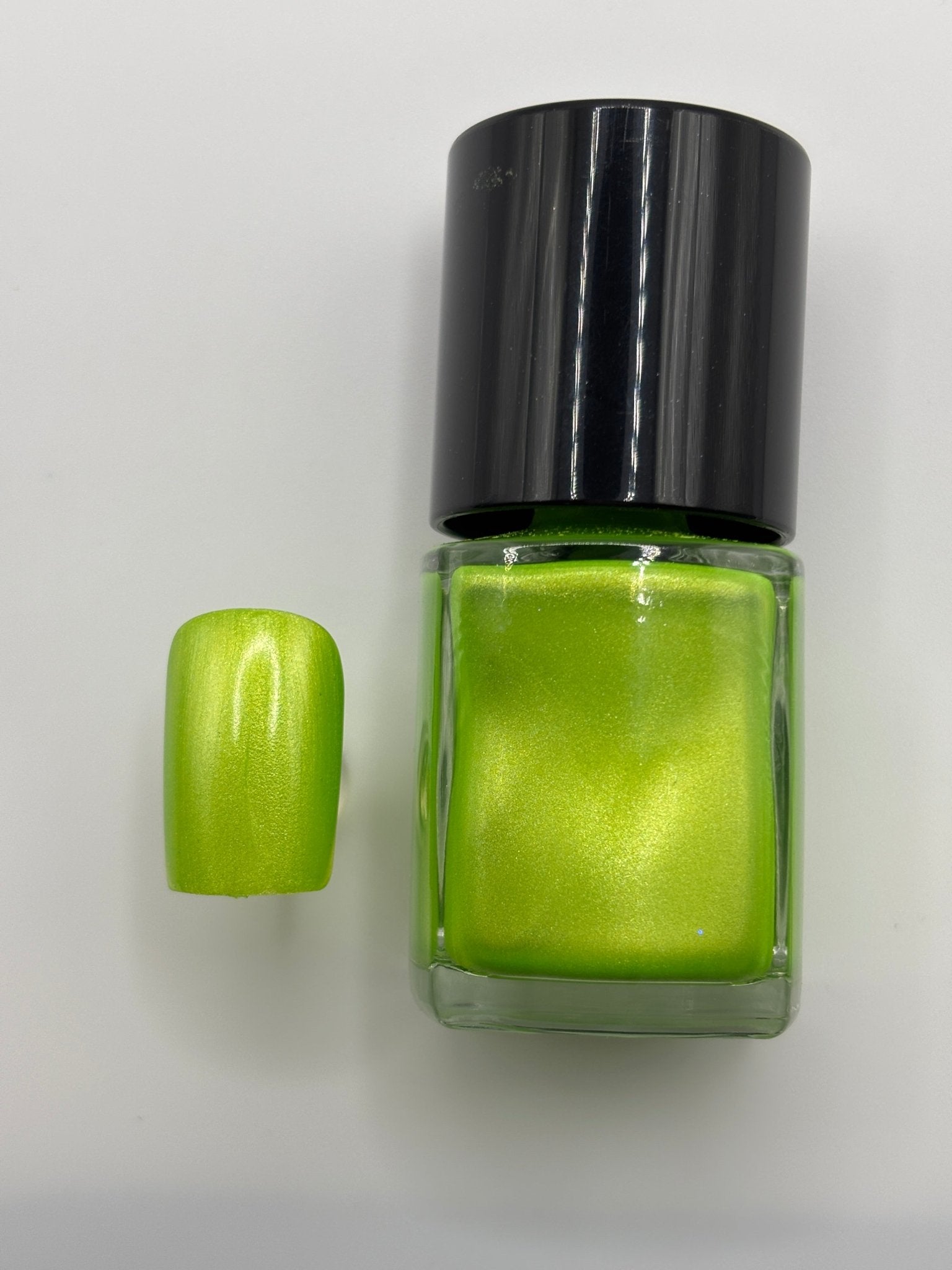 BOTTLE OF VERONICA WITH A FAKE NAIL THE SAME COLOR