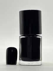 BOTTLE OF NALISA WITH FAKE NAIL BESIDE IT WITH THE SAME COLOR